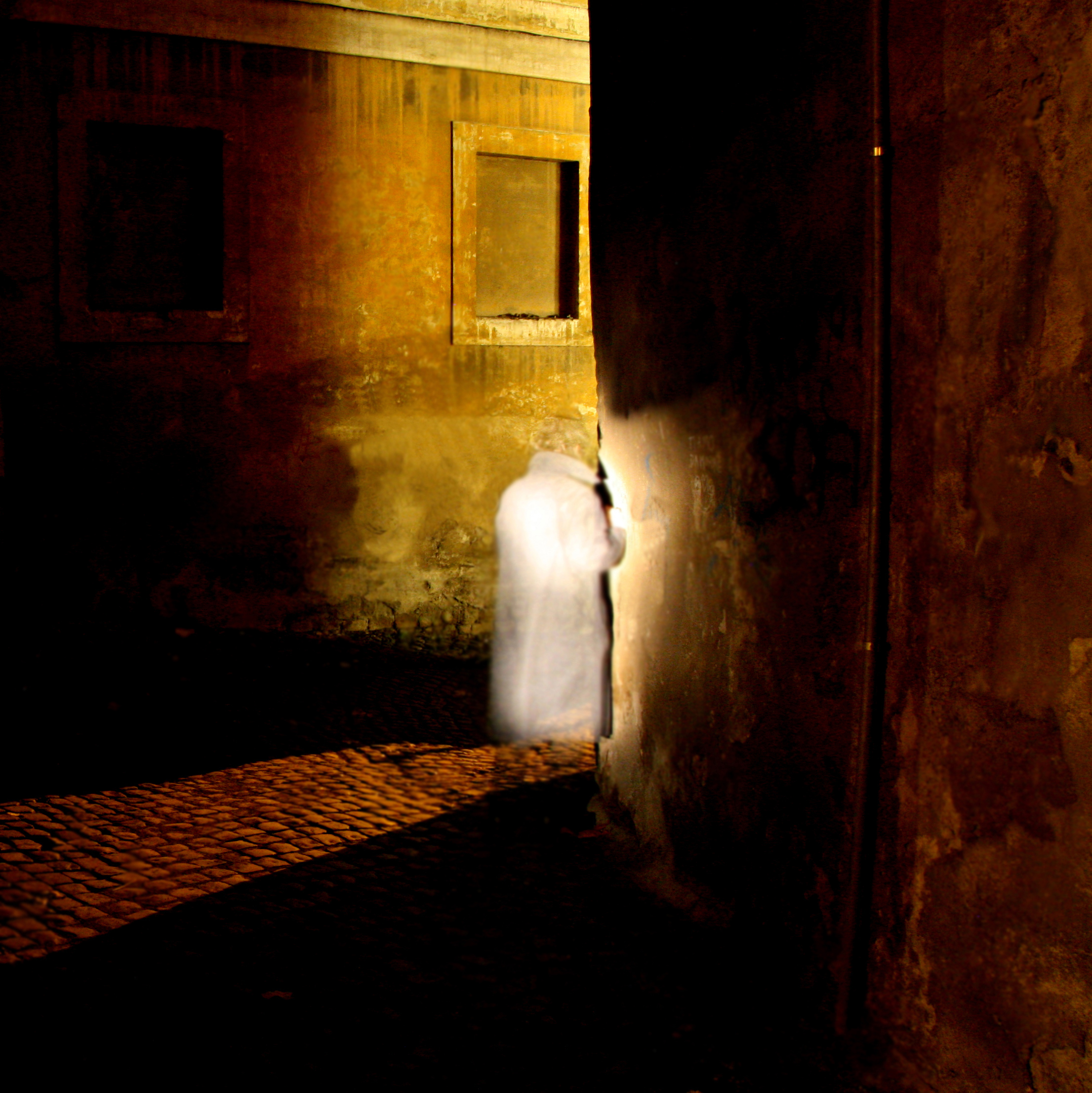 Ghostly figure in white coat walking through dimly lit alley at night