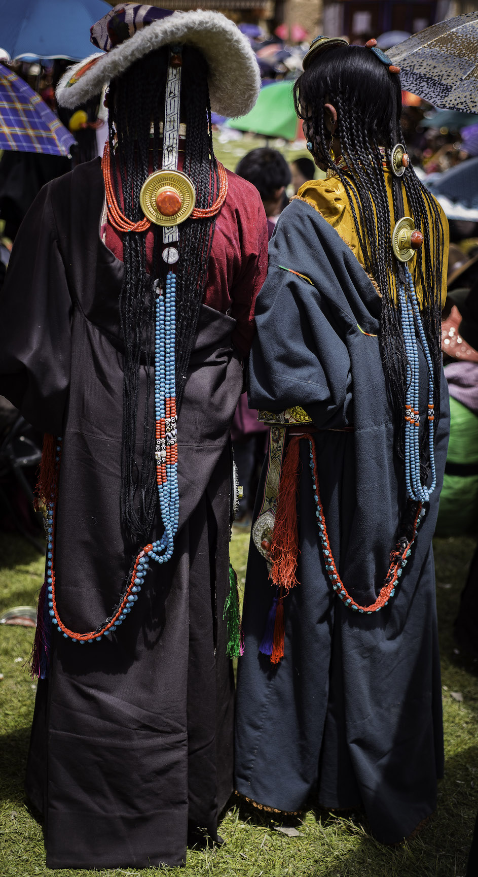 For-Moowon-17-1 Women with traditional hair decorations of coral and turquoise at a Lama Dance Festival.