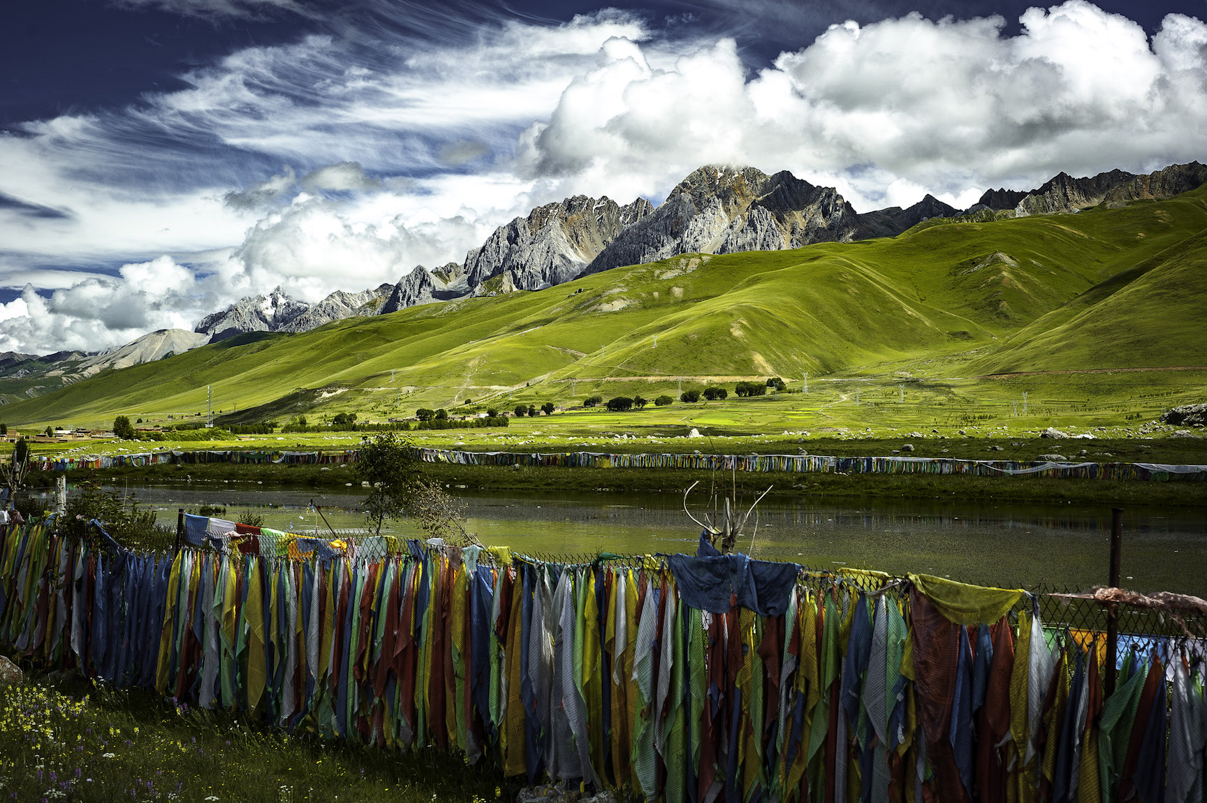 For-Moowon-6 Prayer flags surround a sacred spring near Rongpatsa, Kham.