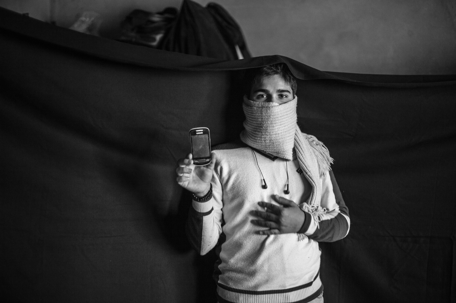 The Most Important Thing: Syrian Refugees Yusuff image with phone