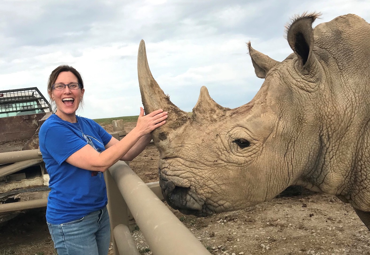 the-wilds-copy girl holding rhino