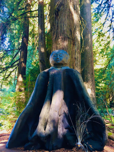 Sculpture by a tree