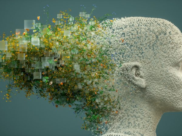 Clay human head with exploding digital pixels